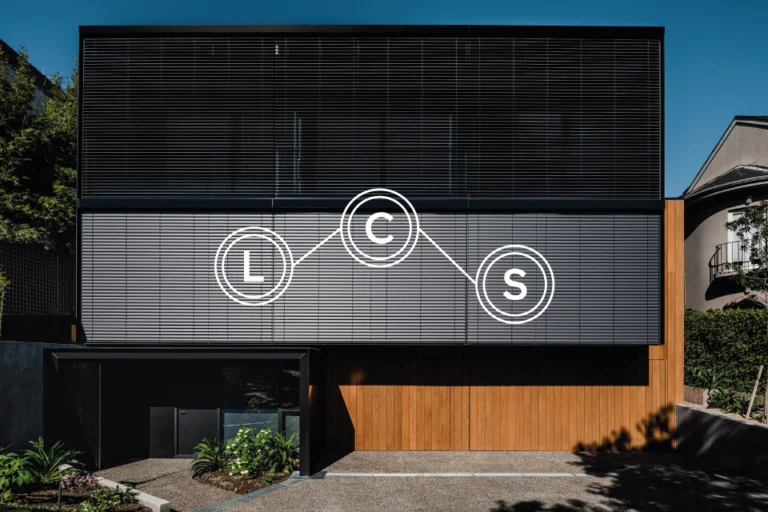 Laser Construction LCS monogram overlaid on a modern house facade with dark louvred screens and timber cladding