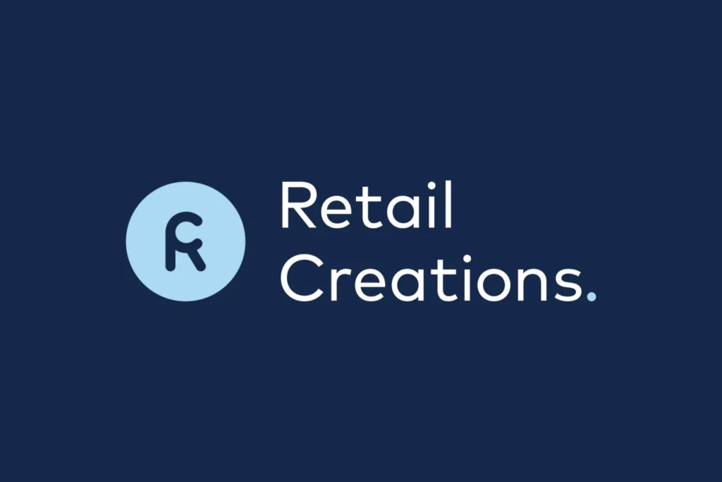 Retail Creations logo: a light blue circular R brandmark beside the wordmark, in white on navy