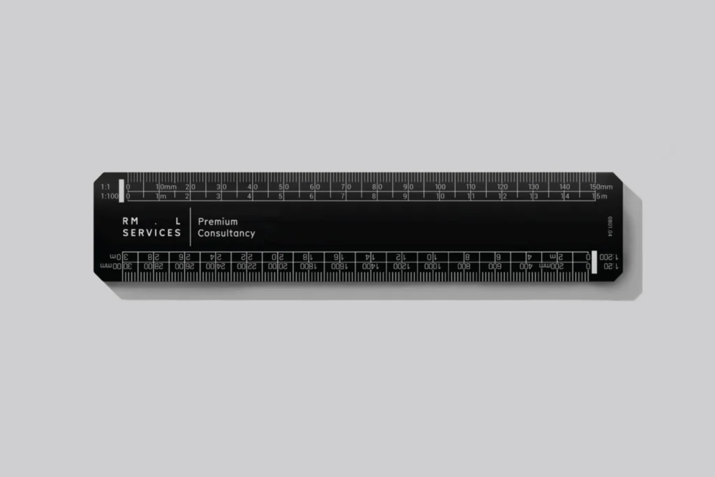 RML Services branded black scale ruler with the wordmark and 'Premium Consultancy' in white, on light grey