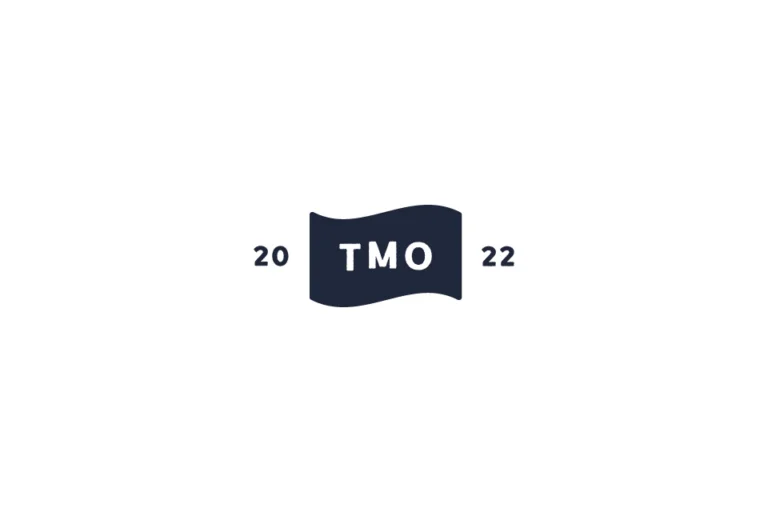 The Mad Ox TMO monogram on a navy waving flag, flanked by 20 and 22, on white