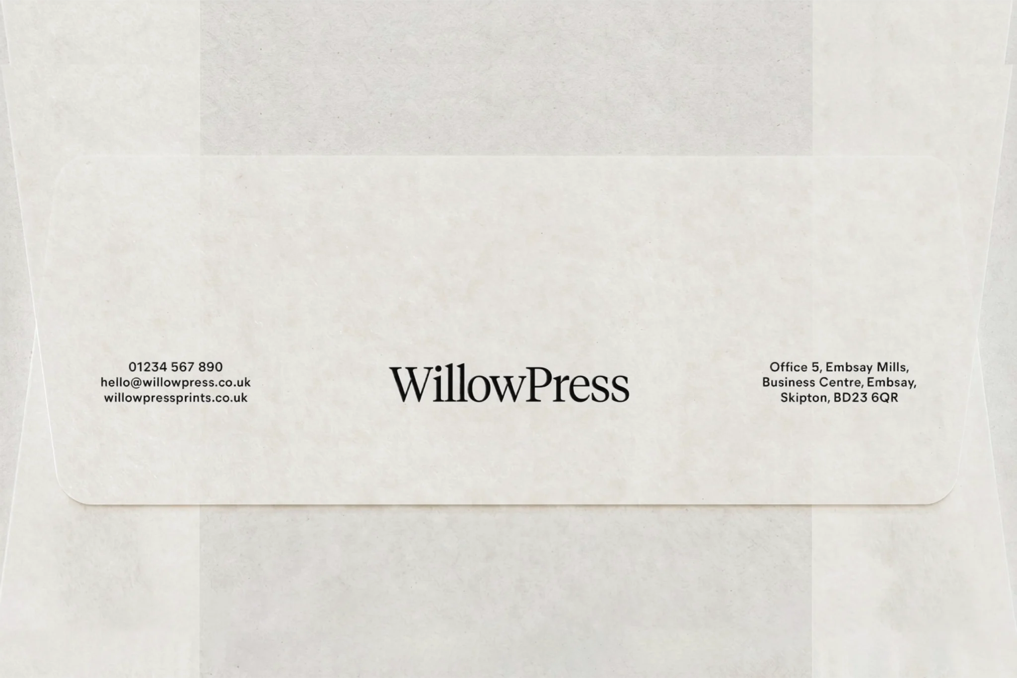 WillowPress envelope flap on textured off-white paper: centred wordmark with contact details and address either side