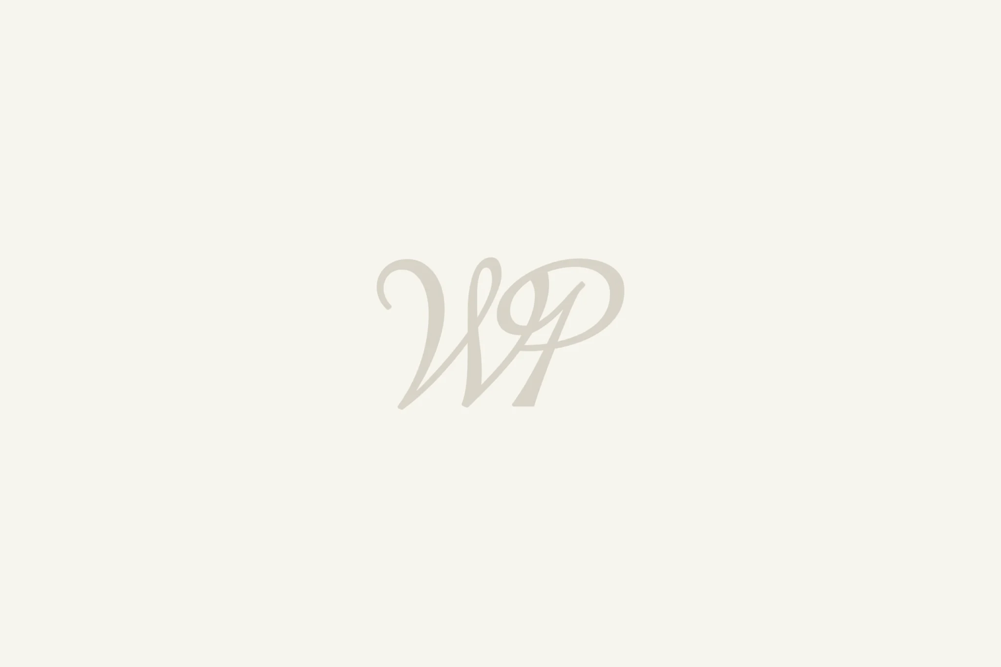 WillowPress WP script monogram in soft beige on an off-white background