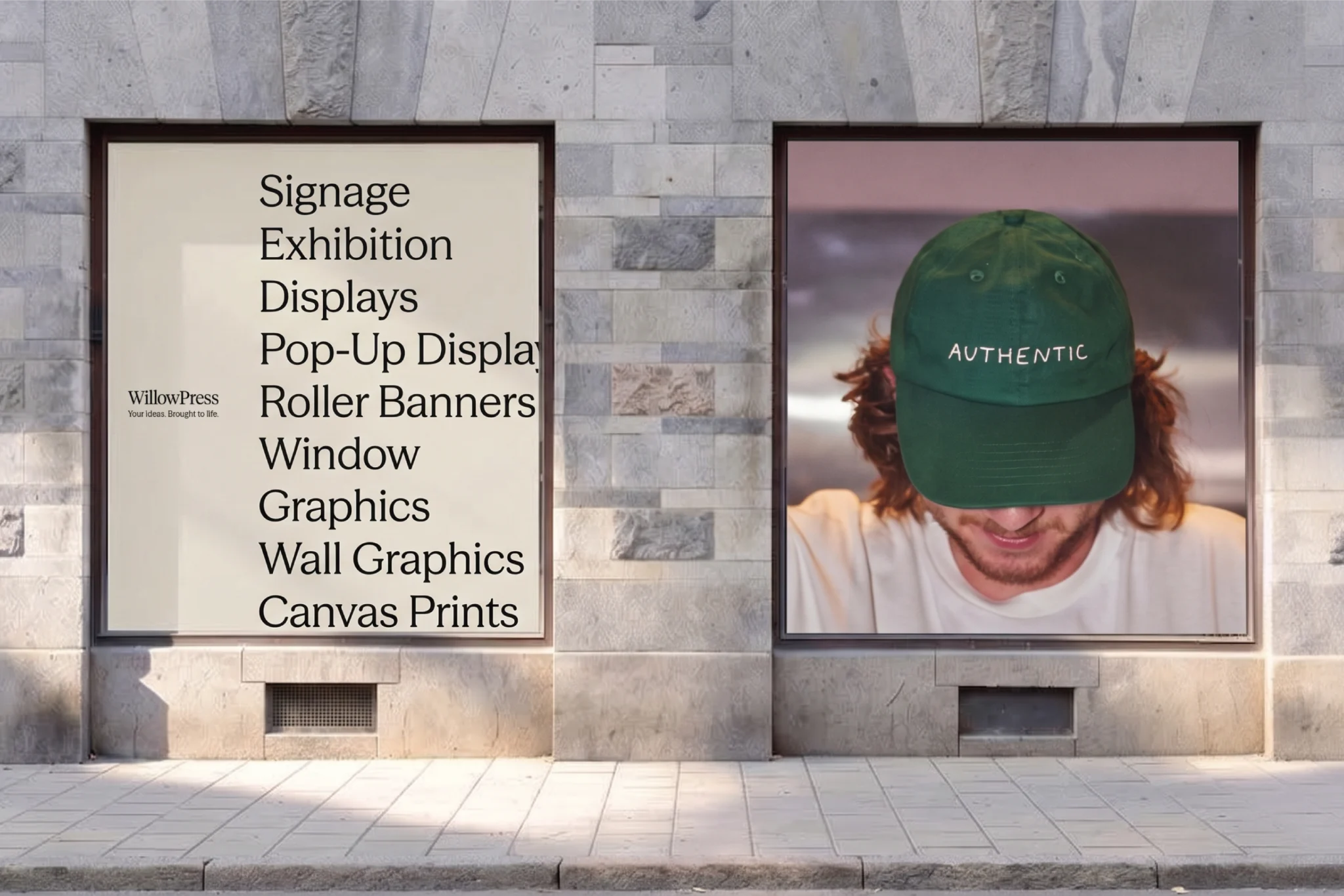 WillowPress posters in a stone shopfront: a list of print services beside a photo of a green cap reading 'Authentic'